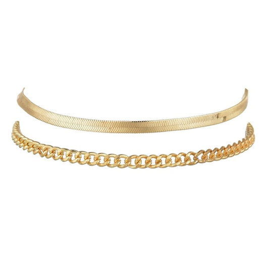 Two anklet set in gold; snake chain and curb chain.