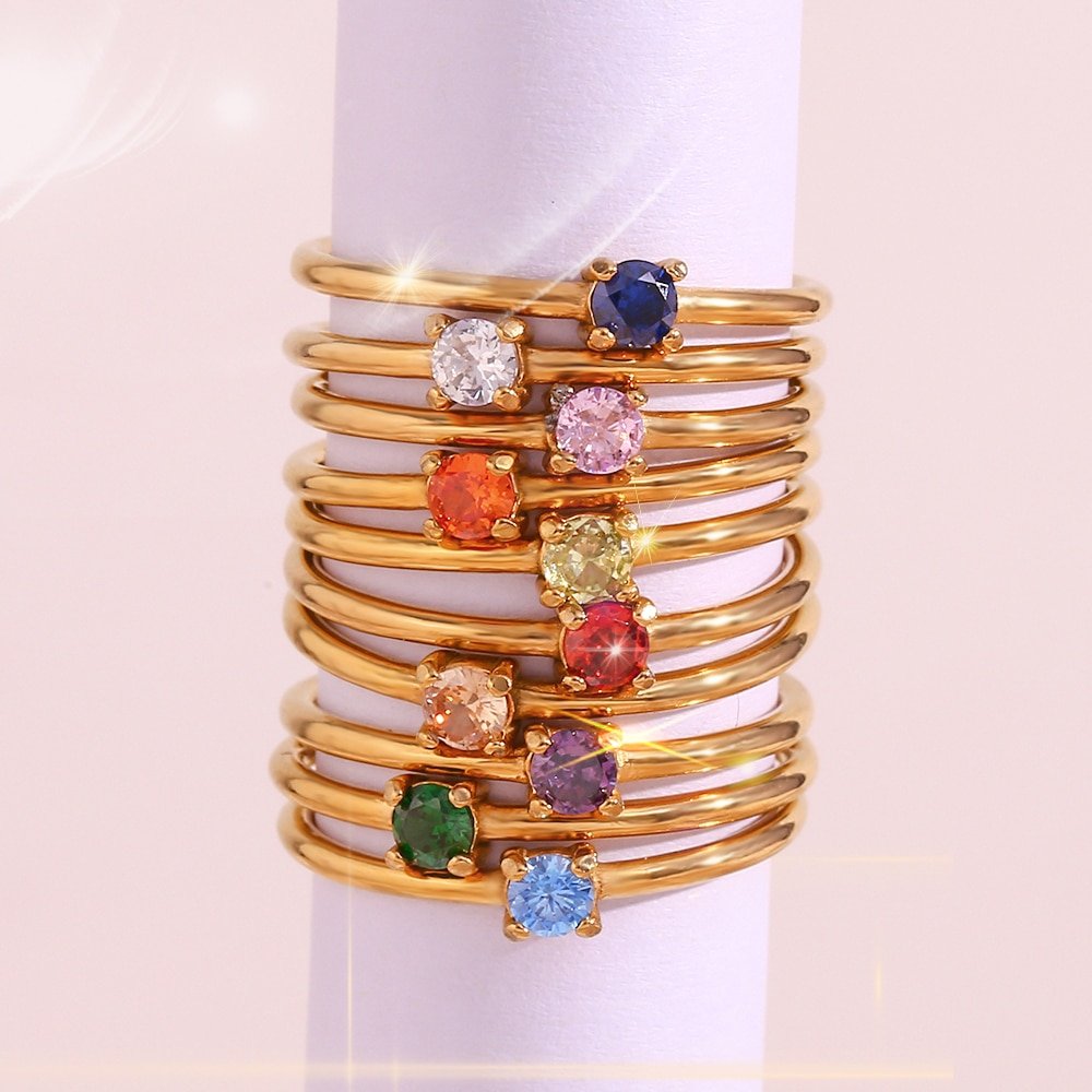 Closeup of the tweleve Birthstone CZ Gold Stacking Rings.
