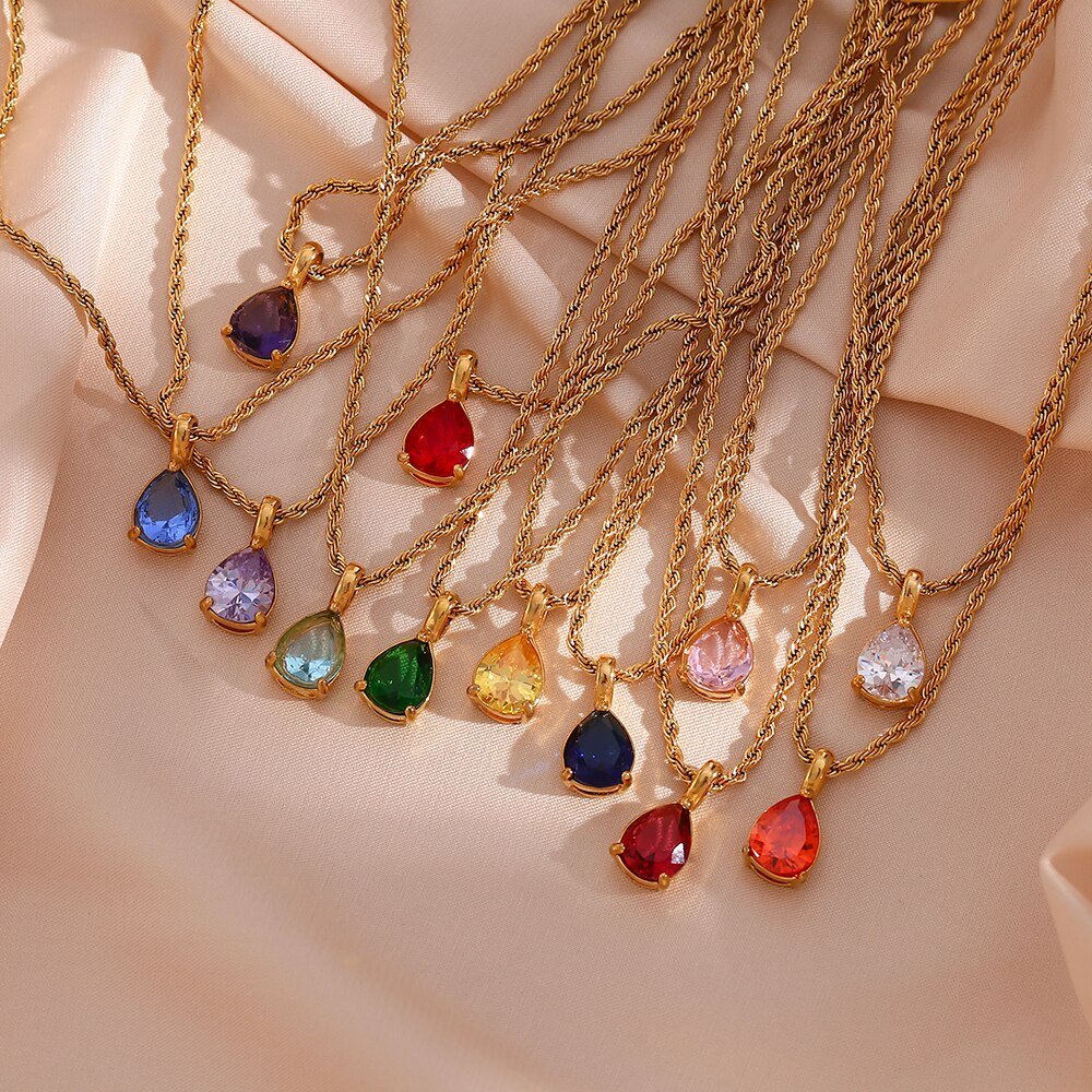 Tweleve teardrop birthstone necklaces.