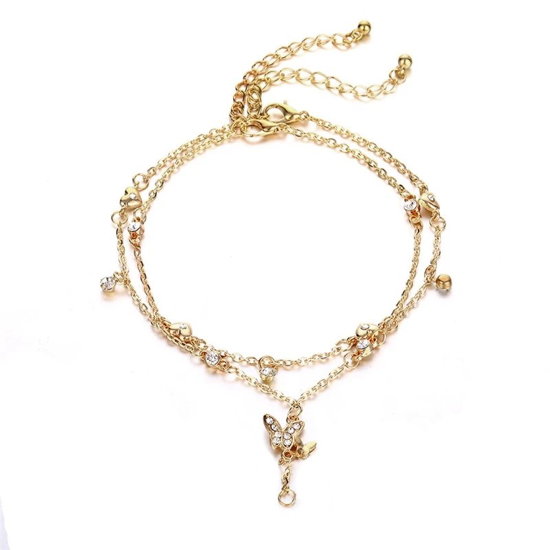 Dainty gold anklet set with CZ stones and a butterfly charm.