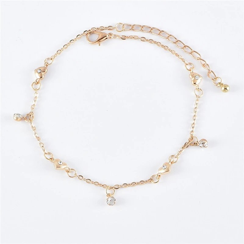 Dainty gold anklet with bezel set CZ stone charms.