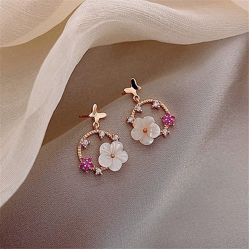 Top view of the Butterfly Flower Rose Gold Earrings.