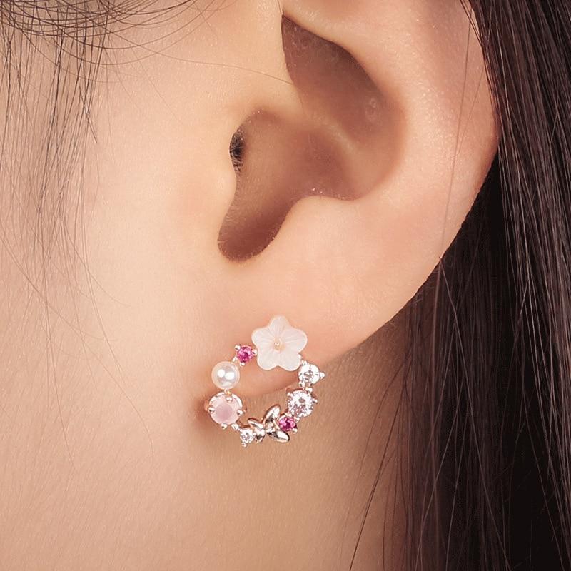 A model wearing the Butterfly Pink Multi-Stone Rose Gold Earrings.