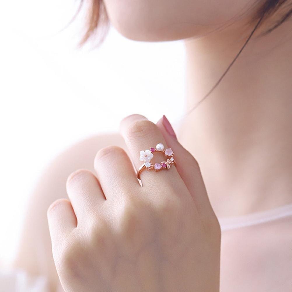 A woman wearing the Butterfly Pink Multi-Stone Rose Gold Ring.