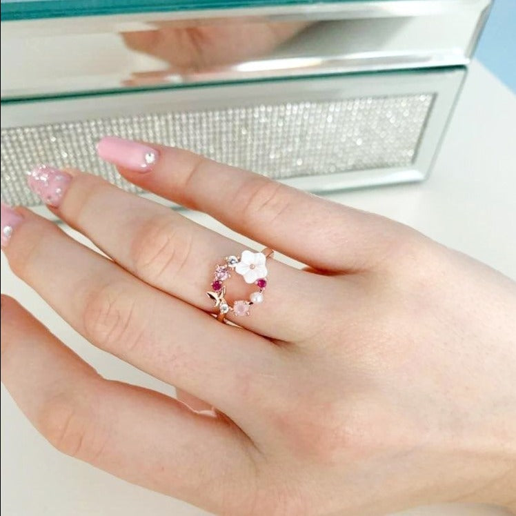 A model wearing the Butterfly Pink Multi-Stone Rose Gold Ring.