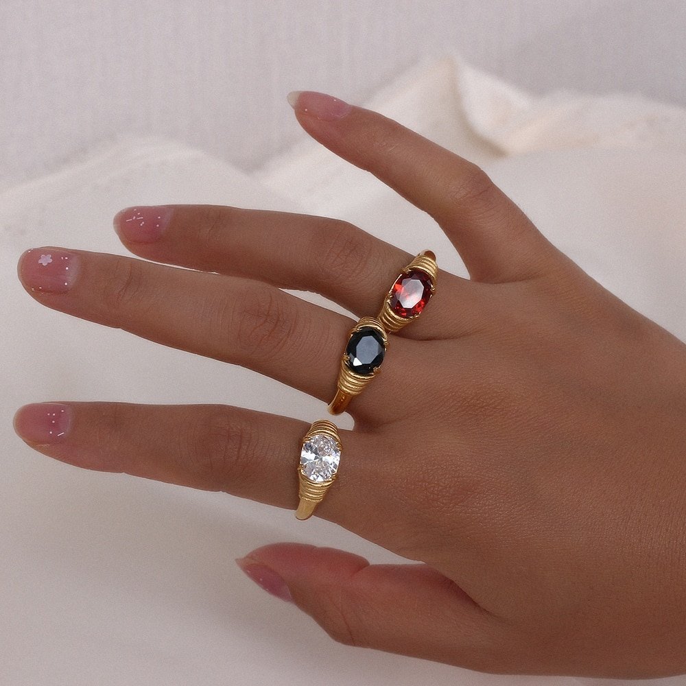 A model wearing three Calafia Rings in gold.