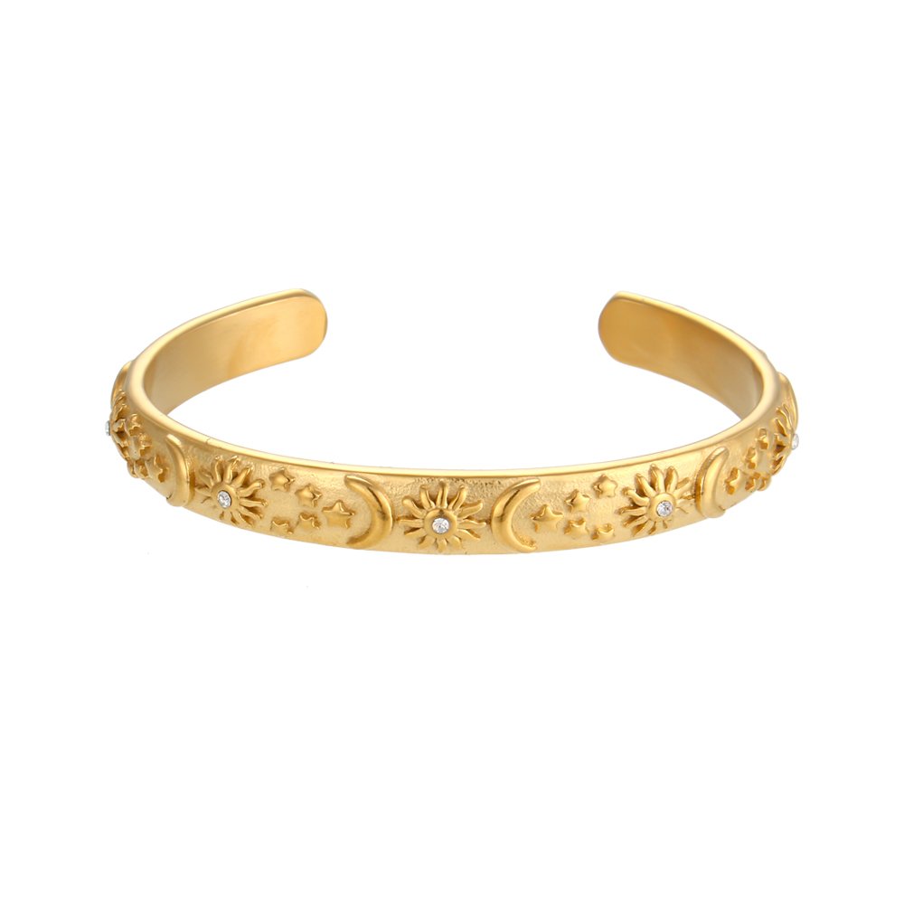 Gold Bracelet with embossed stars, moons and suns..