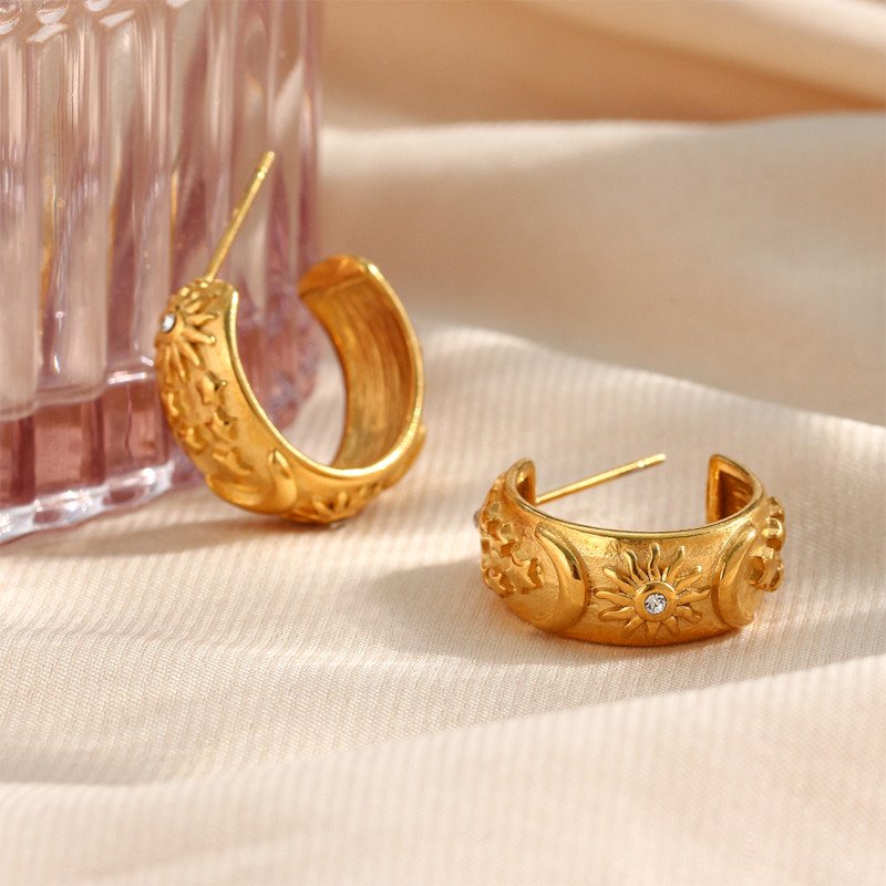 Gold hoops with stars and moons.