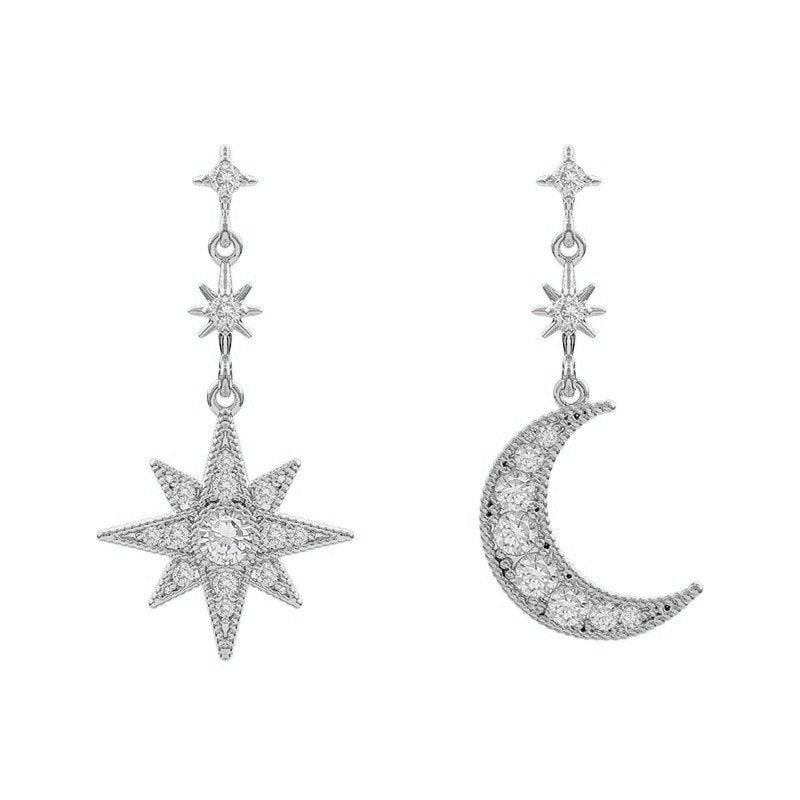 Silver star and moon mismatched earrings.