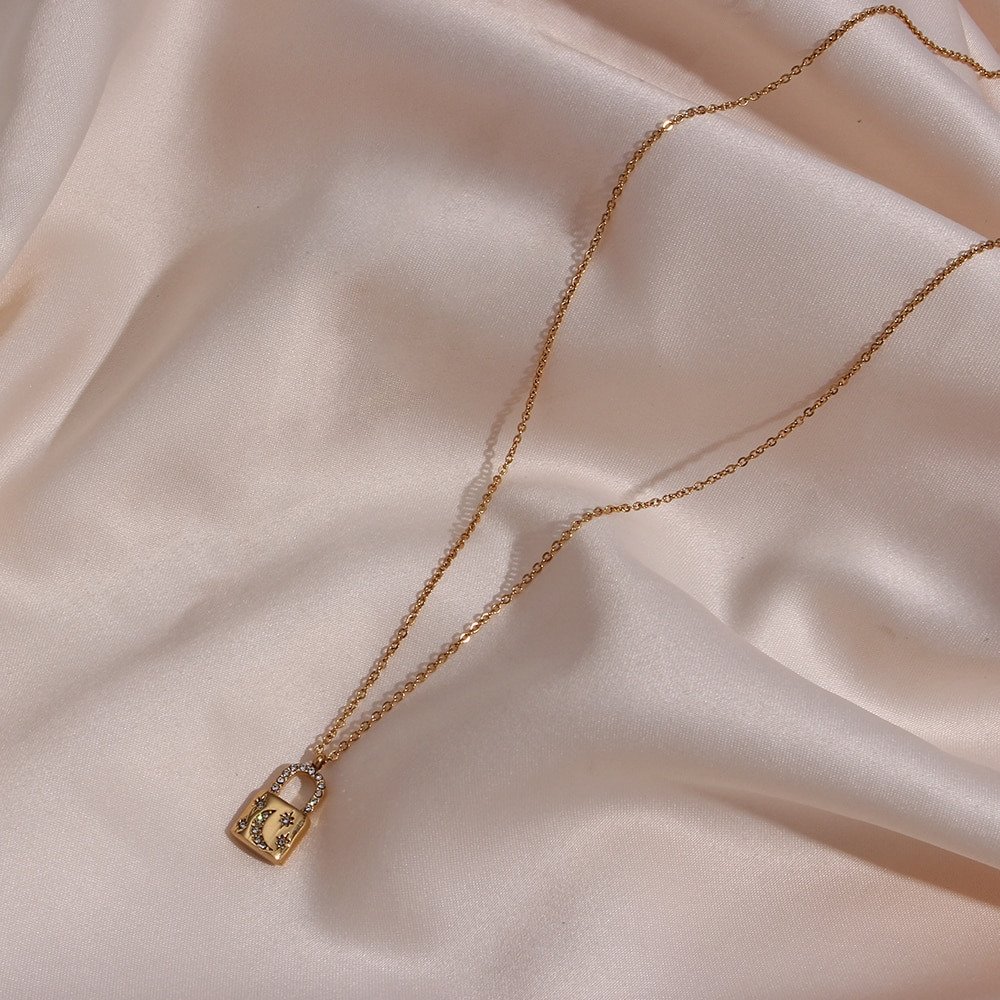 Gold padlock necklace.