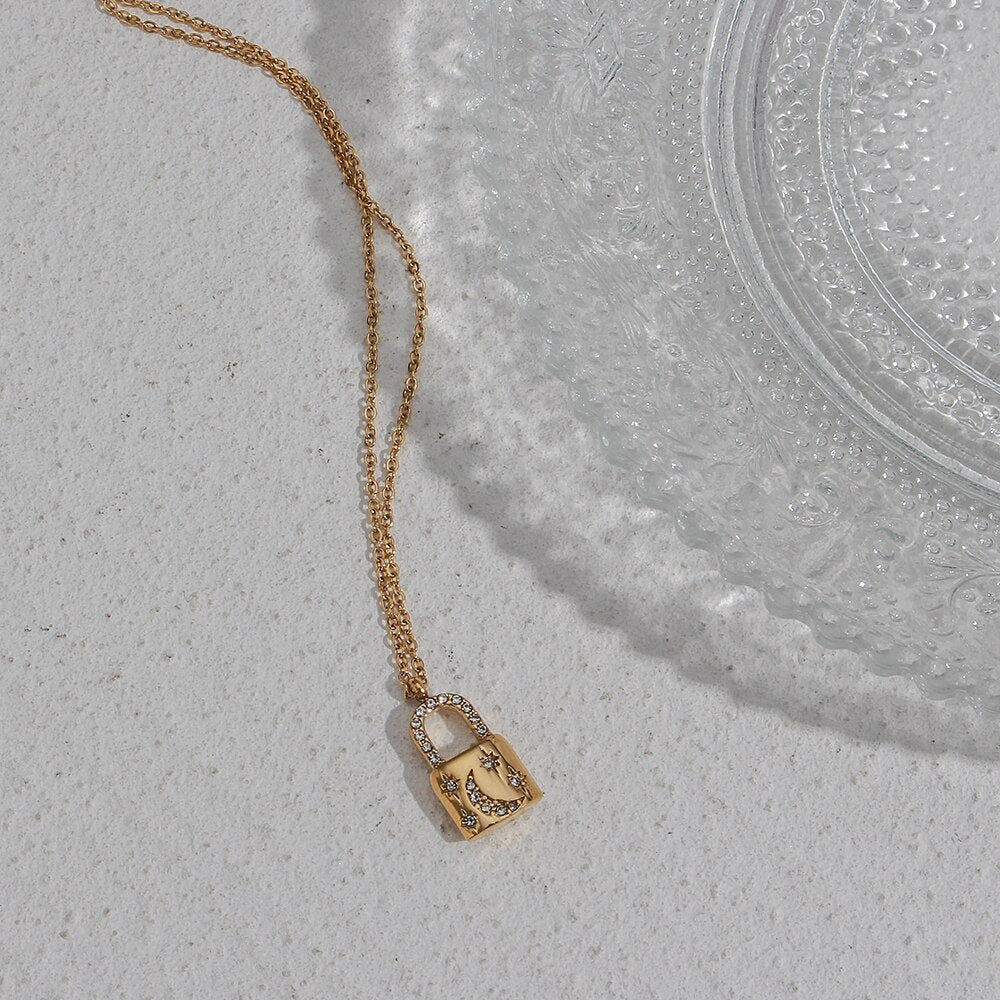 Gold padlock pendant with CZ moon.