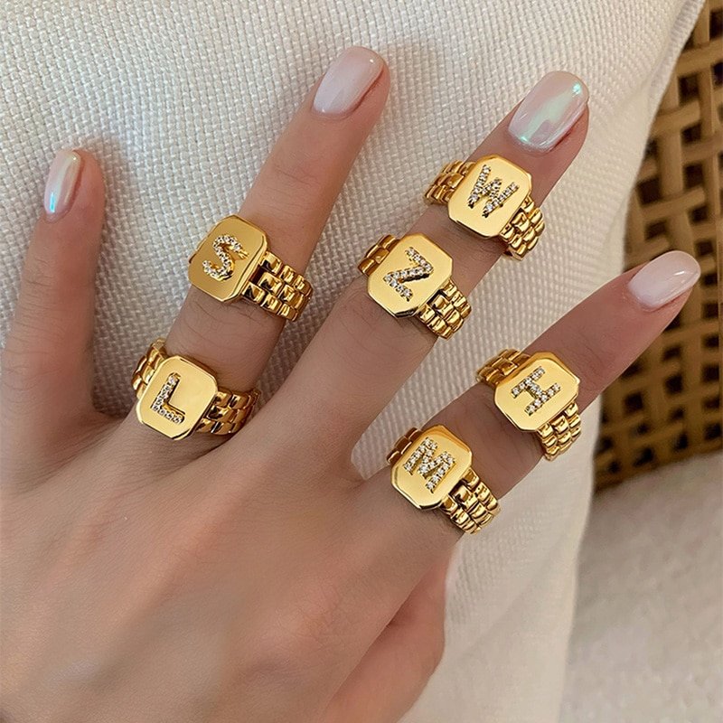 A model wearing multiple Chunky Gold Initial Rings.