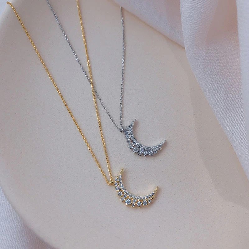 Closeup of the Crystal Crescent Moon Necklace.