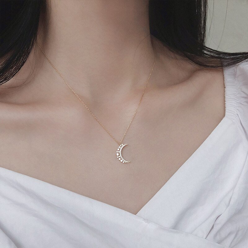 A model wearing the Crystal Crescent Moon Necklace.