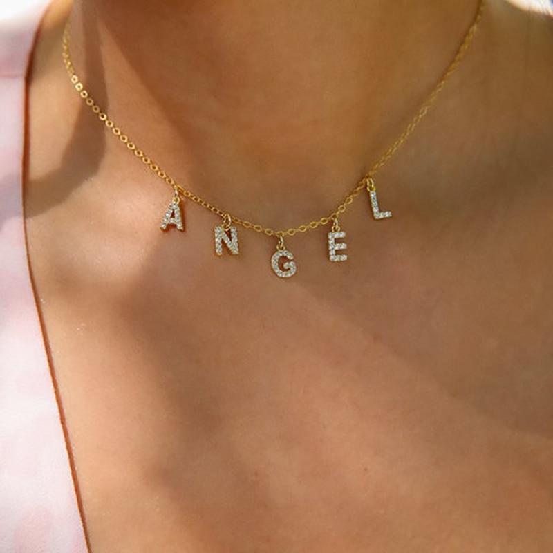 A model wearing an "Angel" name necklace.