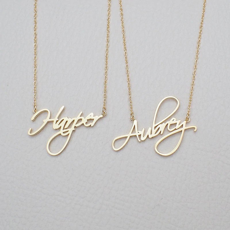 Two name examples in cursive script font custom name necklace.