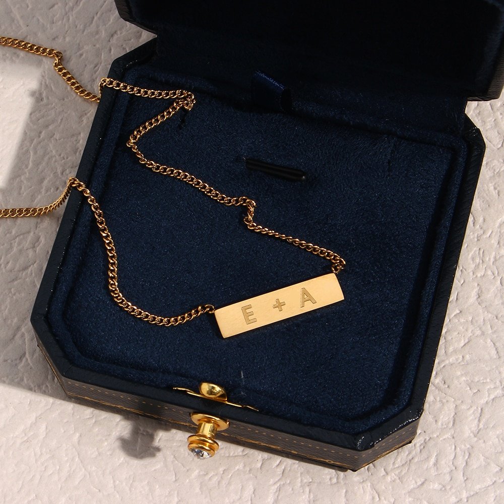 Closeup of the Custom Name Plate Necklace.