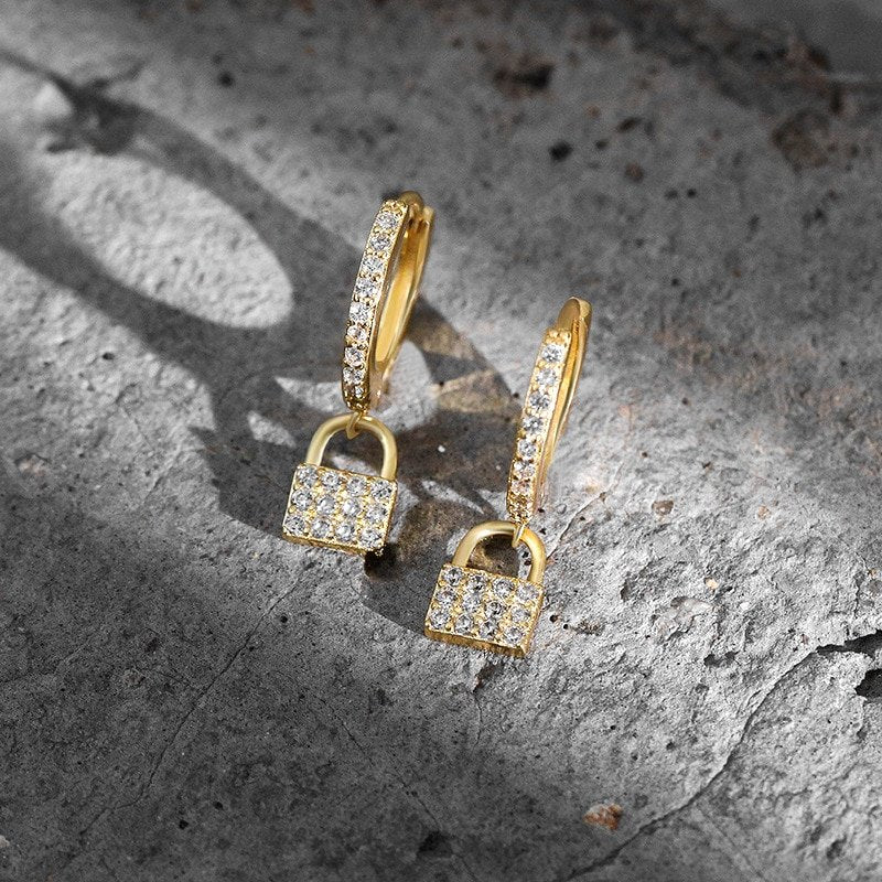 Closeup of the gold CZ Pave Padlock Huggies.