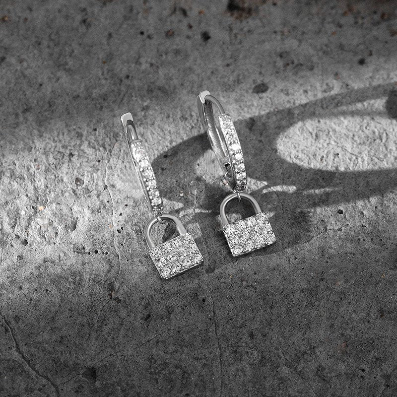 Closeup of the silver CZ Pave Padlock Huggies.