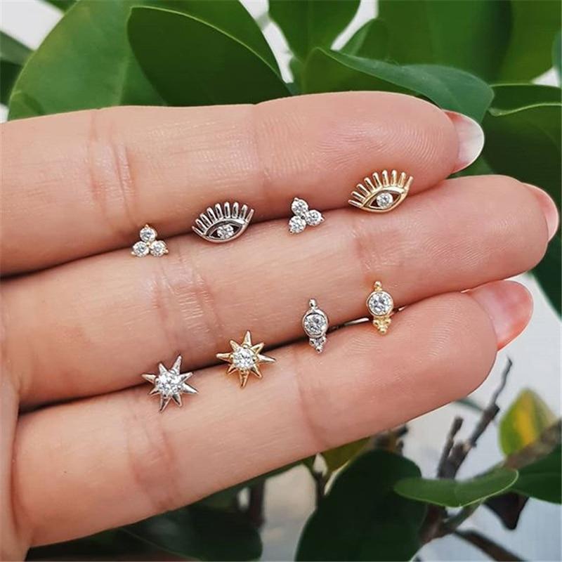 A model holding the different stud earrings.