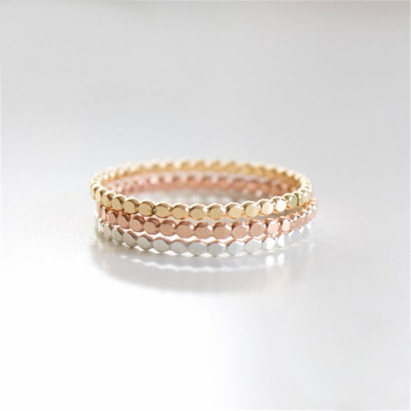 Gold, rose gold and silver stacking rings.