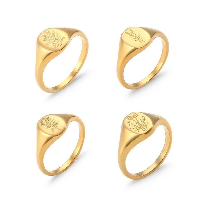 Gold floral oval signet rings.