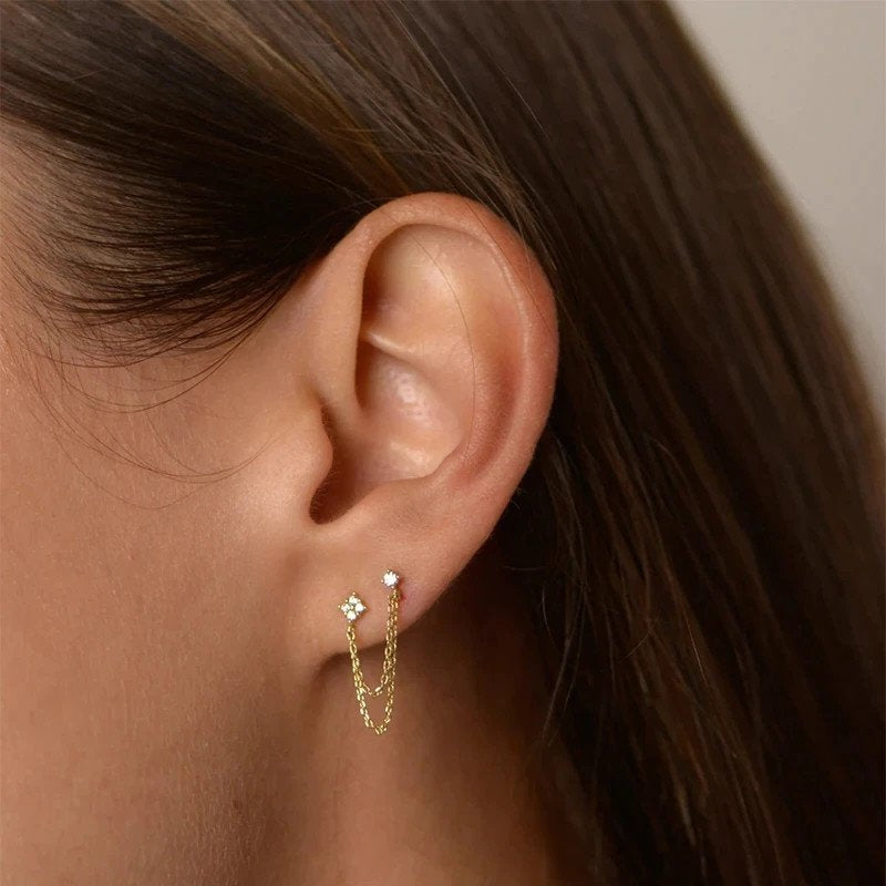 A model wearing the Flower Double Stud Chain Earrings.