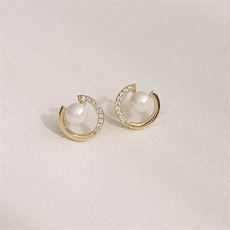 Pearl stud earrings.