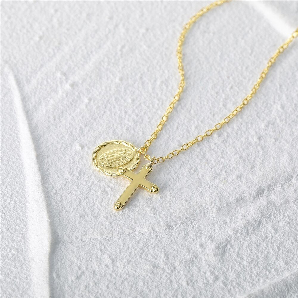 Gold cross and Virgin mary charm necklace.