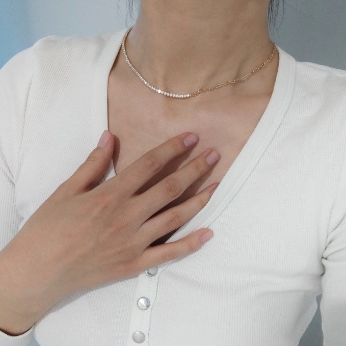 A woman wearing the Gold Paperclip Chain CZ Necklace.