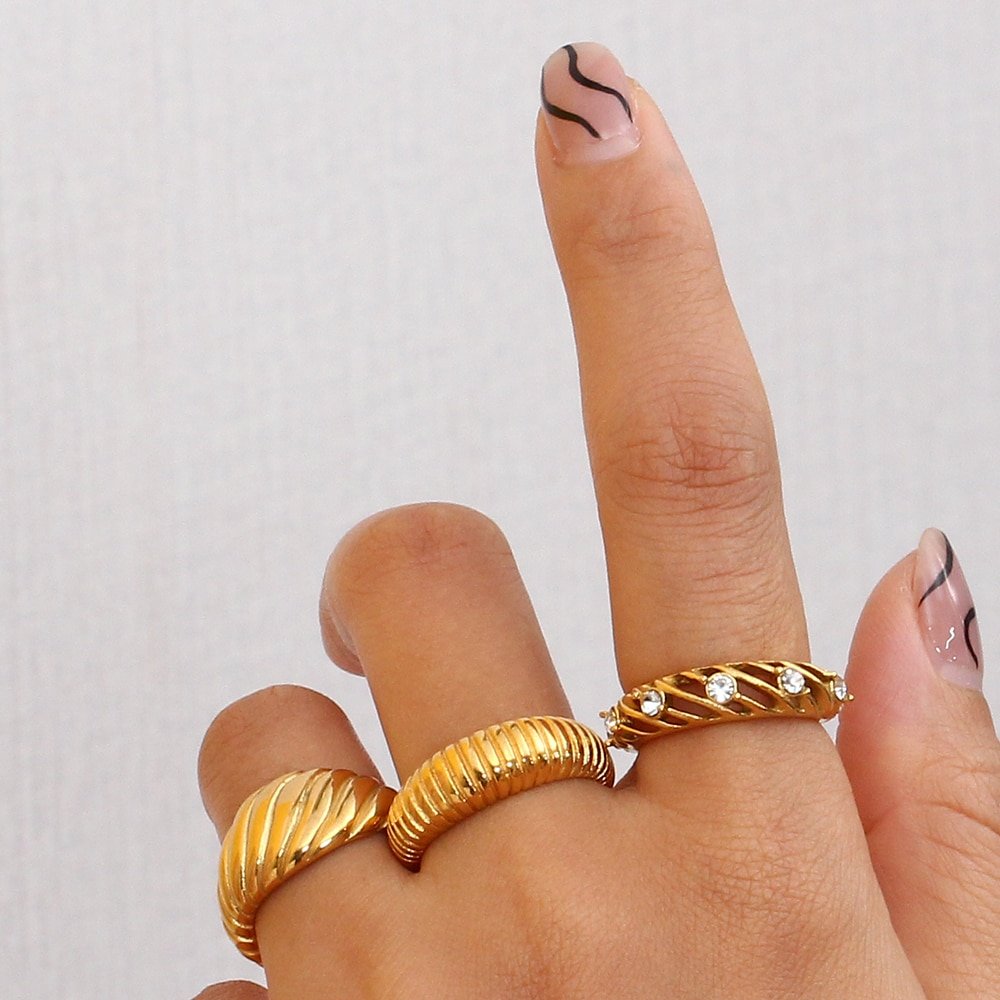 A woman wearing the Hollow CZ Gold Ring.