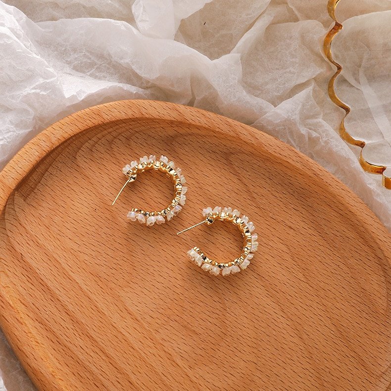 Side view of the Iridescent Flower Hoops in Gold.