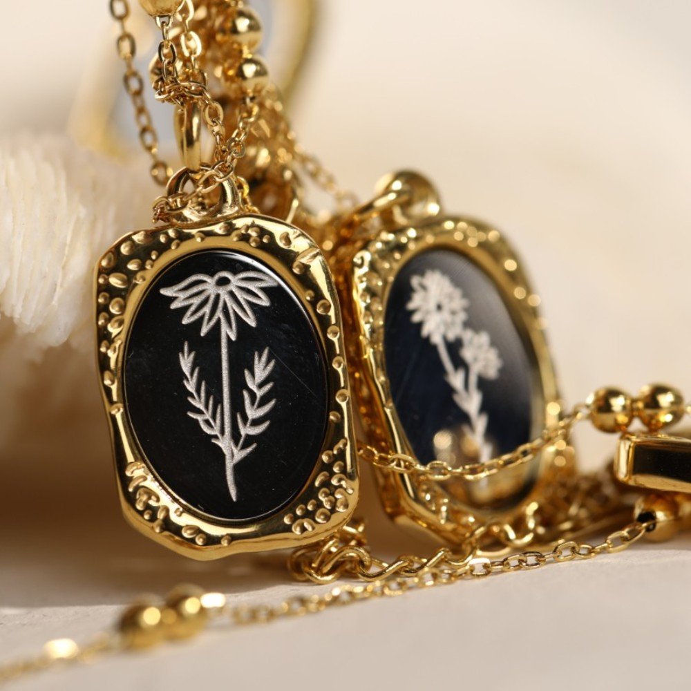 Closeup of the Mirrored Birth Flower Gold Necklace.