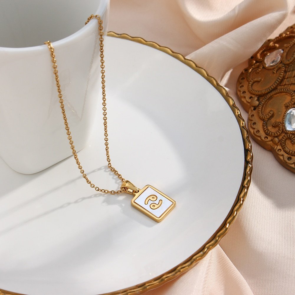 Closeup of the Mother of Pearl Zodiac Gold Necklace.