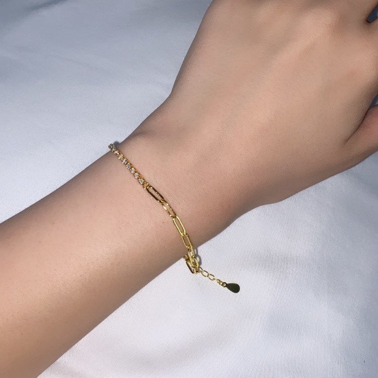 A model wearing the clear Paperclip CZ Tennis Gold Bracelet.