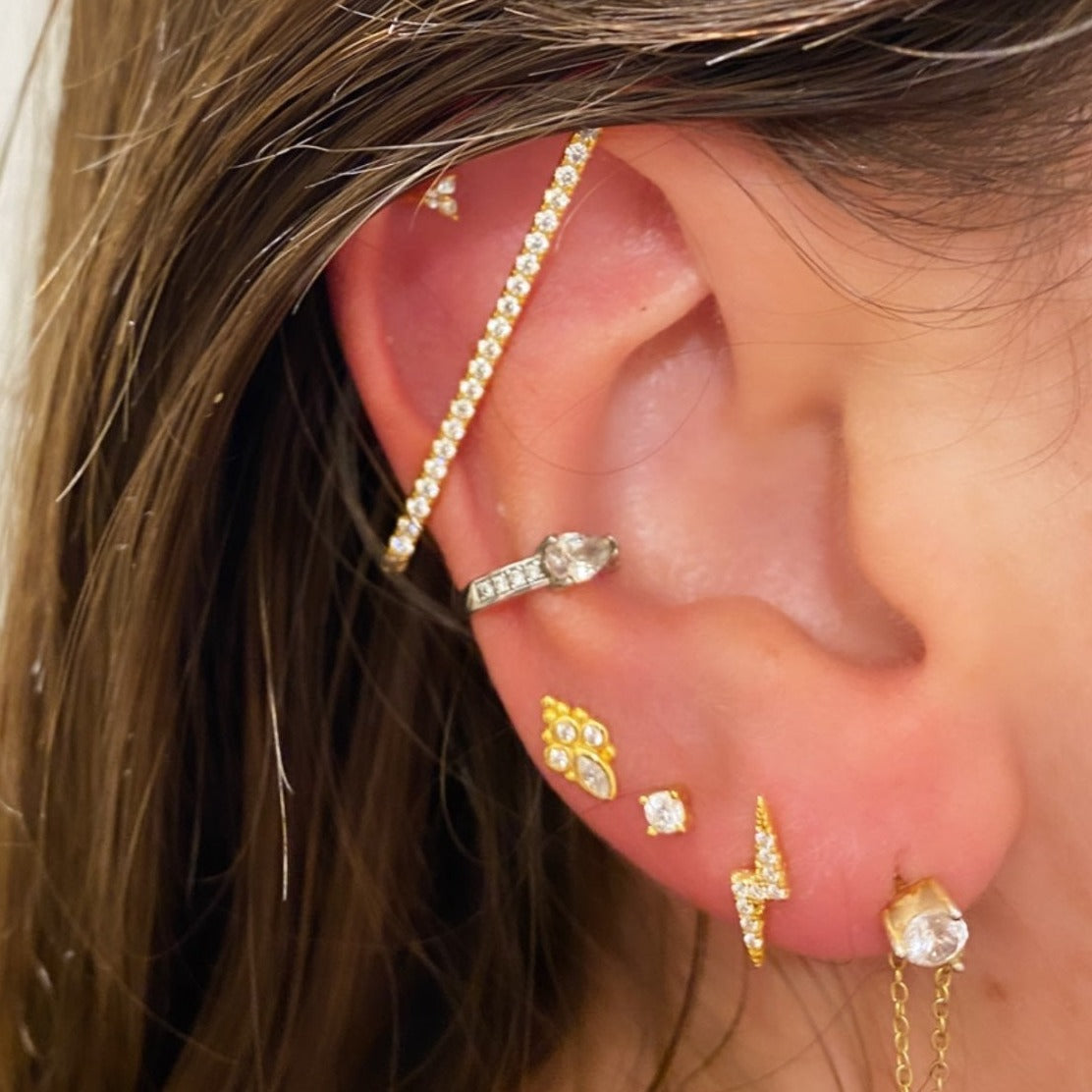 A model wearing the Pave Lightning Bolt Cartilage Stud.