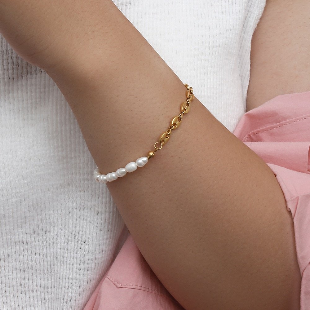 A model wearing the Pearl Anchor Chain Bracelet.