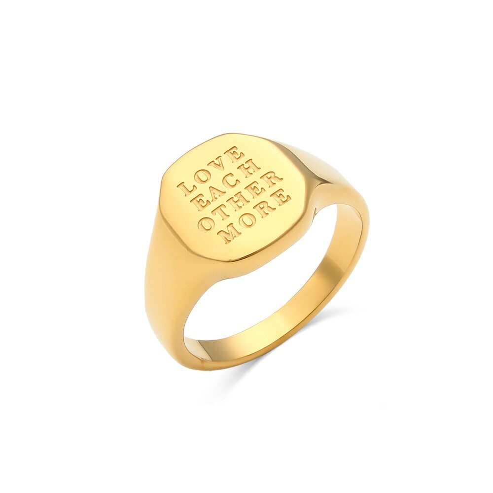 Gold signet ring engraved with "Love Each Other More".