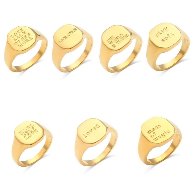 Seven gold Positive Message Signet Rings.