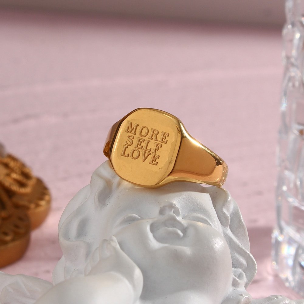 "More Self Love" engraved gold signet ring.