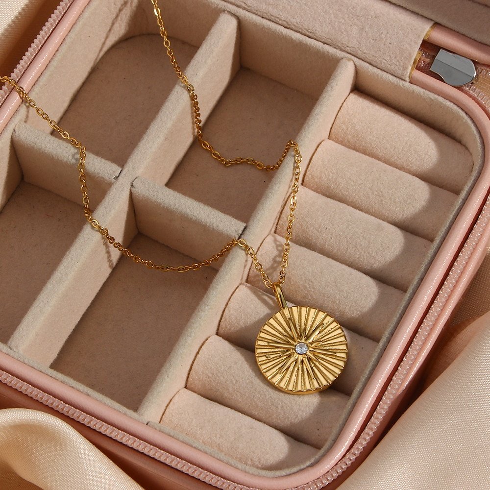 Closeup of the Radiating Star Gold Coin Necklace.