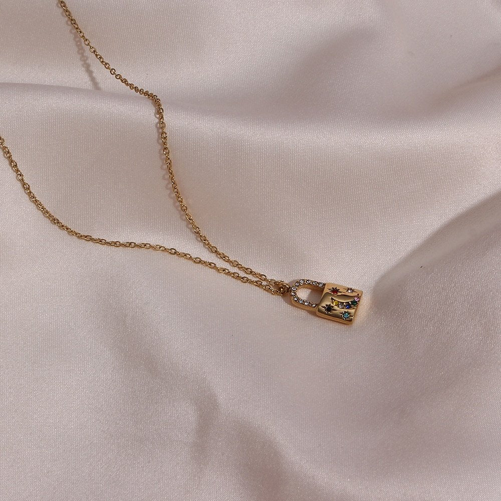 Crescent moon rainbow CZ padlock necklace in gold.