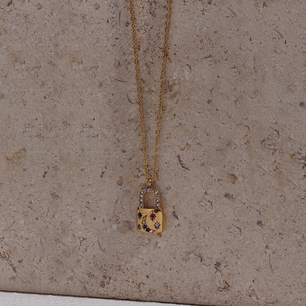 Gold padlock pendant necklace.