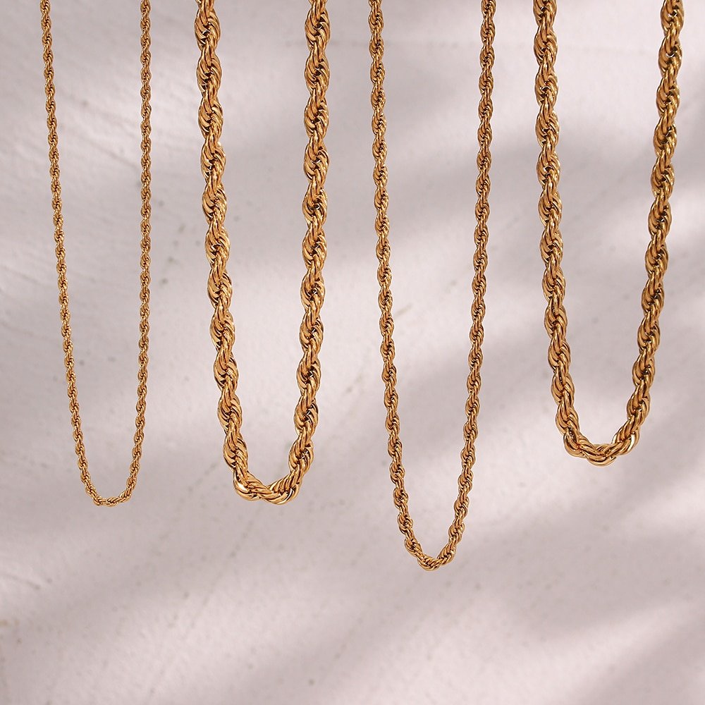Four gold rope chain necklaces.