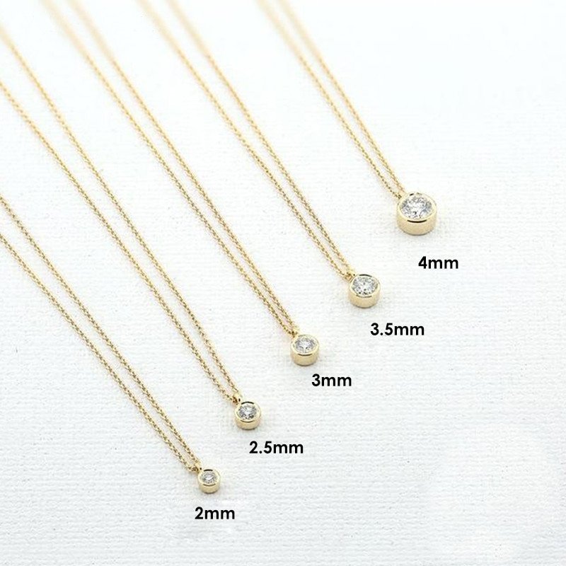Short CZ Gold Necklace with fives sizes of CZ pendants.