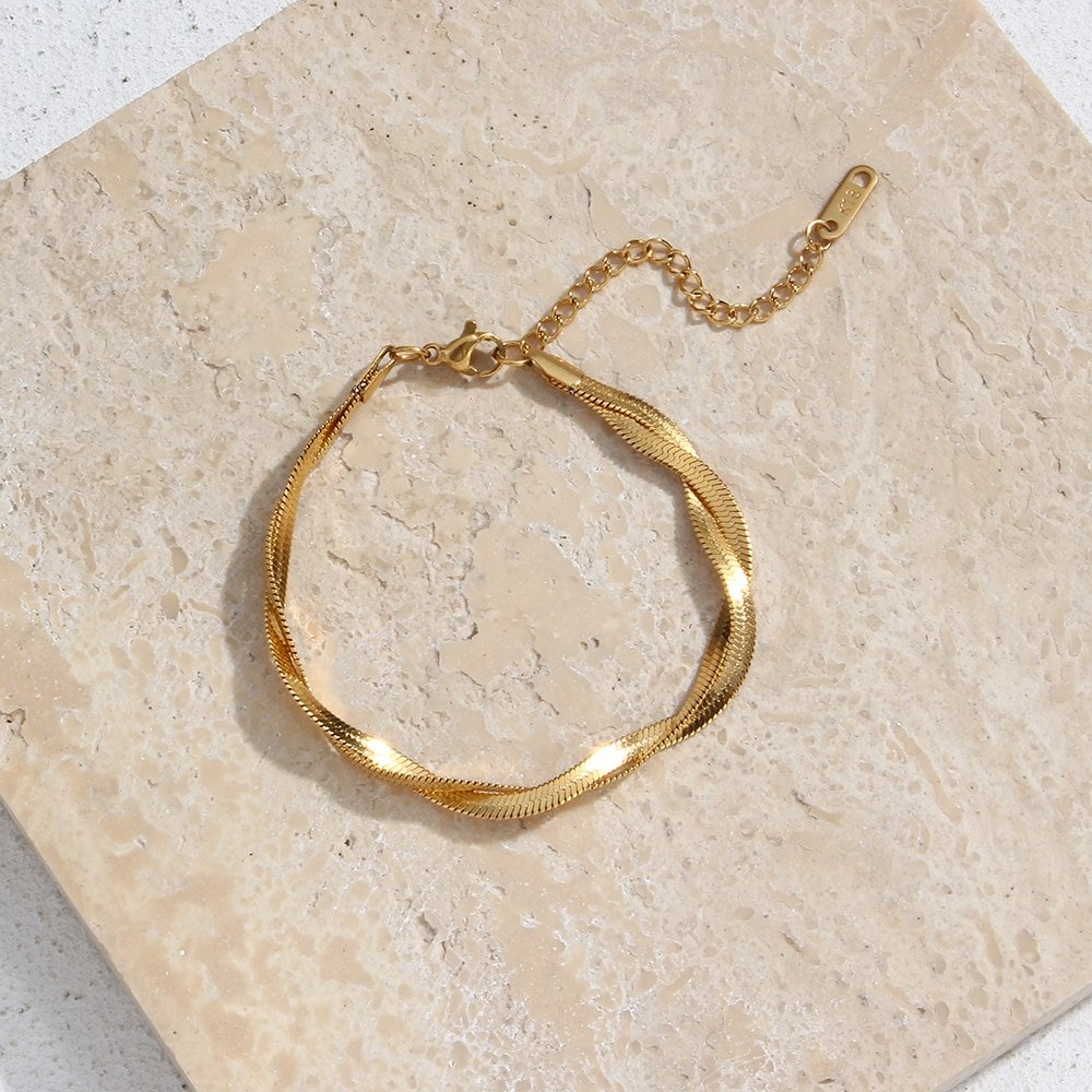 Closeup of the gold snake chain twist bracelet.