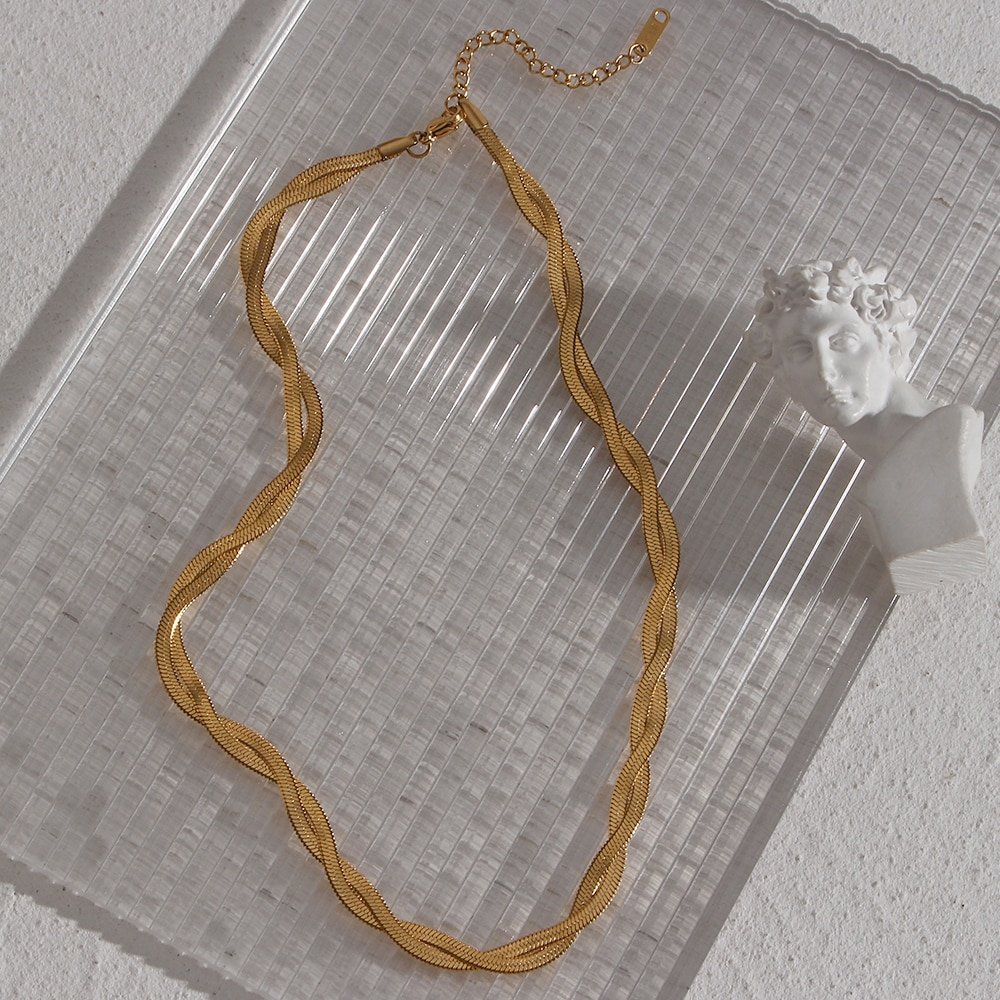 Short gold herringbone necklace chain.