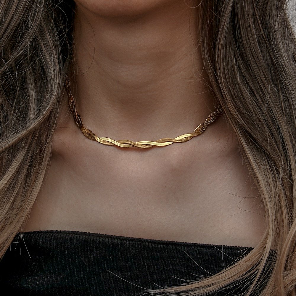 Gold chain with a twist design.
