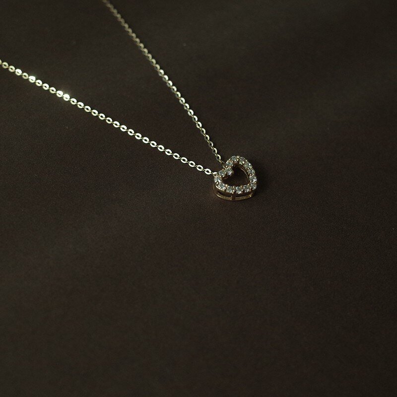 Closeup of the Sparkling Gold Heart Necklace.