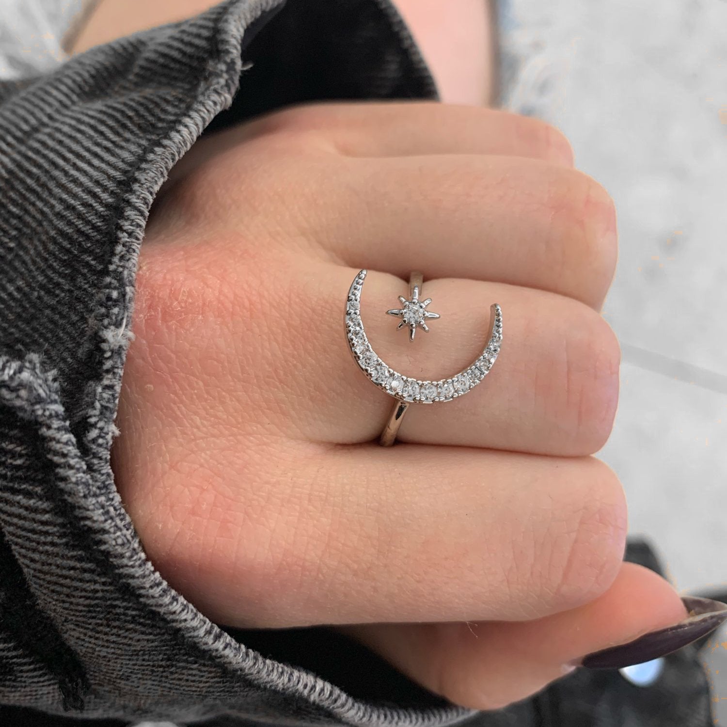 Star Crescent Moon Ring on a woman's finger.